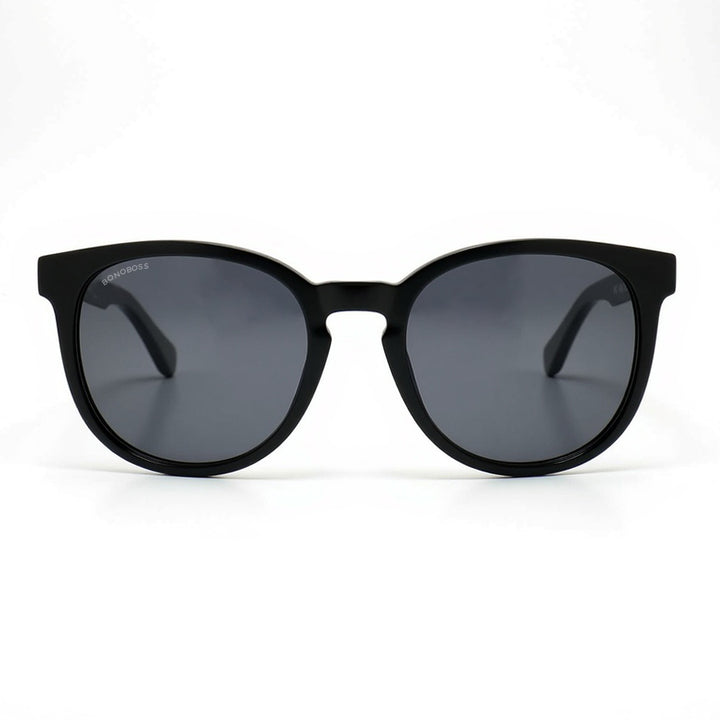 anteojos redondos de plástico reciclado y varillas de madera natural sustentable con lentes de color negro. Polarizadas y forma redonda.  #color_negro