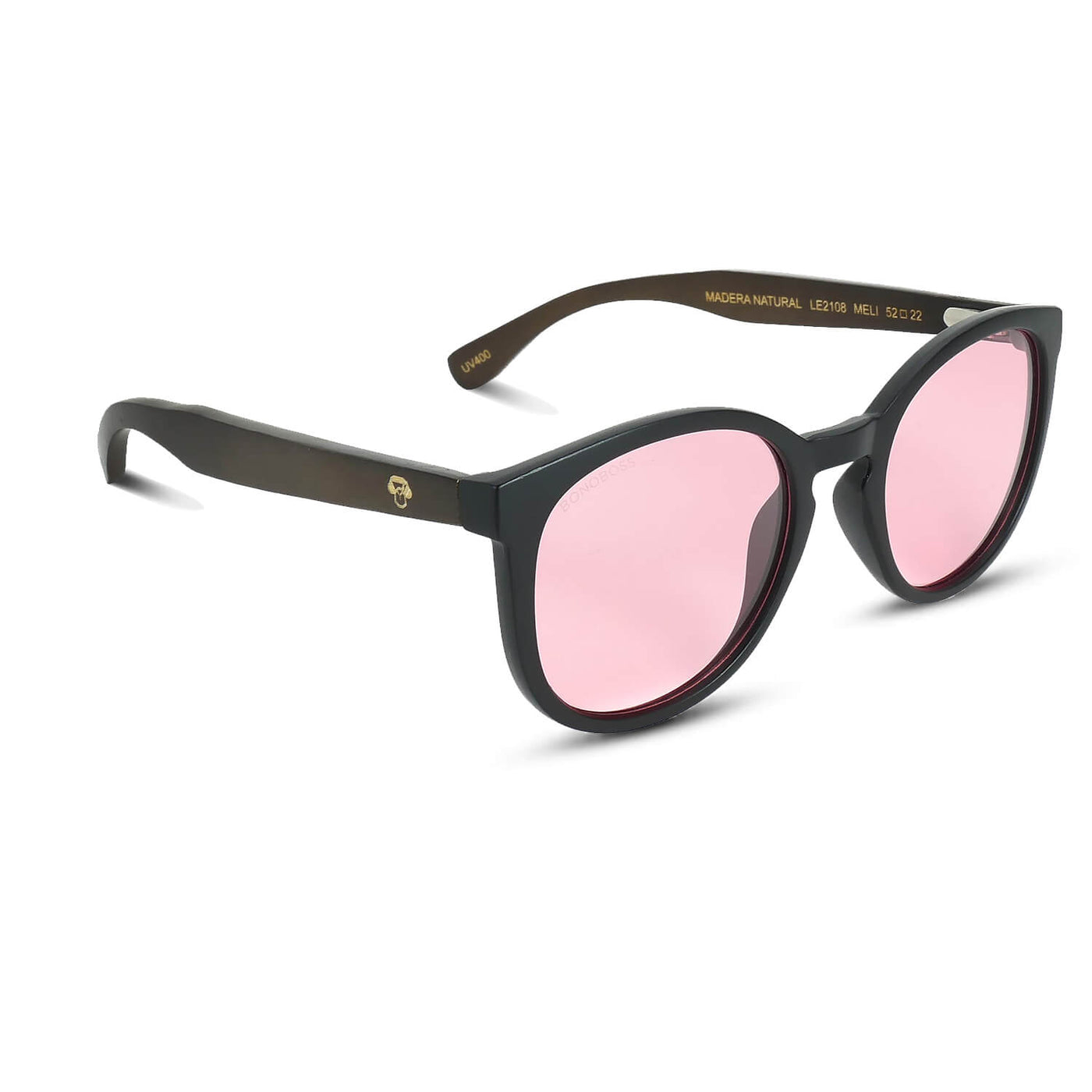 anteojos redondos de plástico reciclado y varillas de madera natural sustentable con lentes de color rosado polarizadas y forma redonda. 