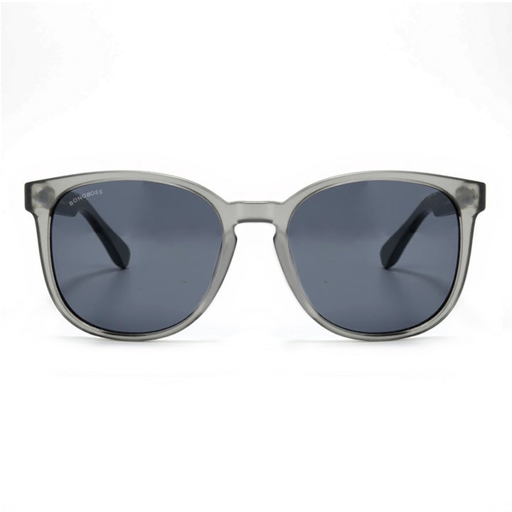 anteojos redondos de plástico reciclado y varillas de madera natural sustentable con lentes de color rosado. Polarizadas y forma redonda. La gafa es color transparente #color_negro