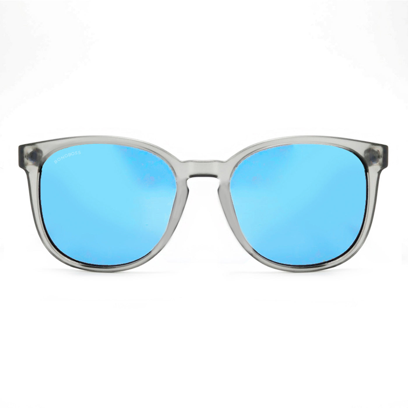 anteojos redondos de plástico reciclado y varillas de madera natural sustentable con lentes de color espejado azul. Polarizadas y forma redonda. La gafa es color transparente