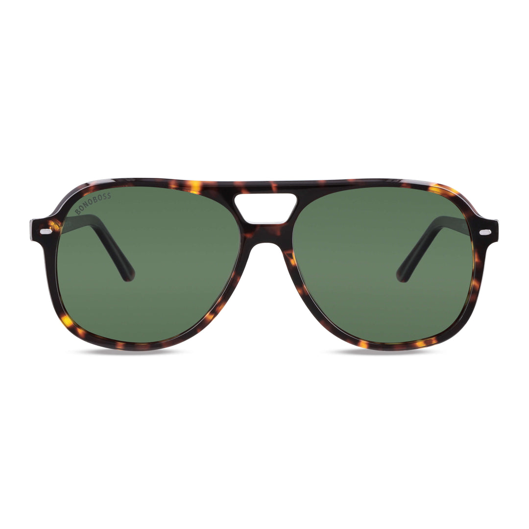 vista frontal de unos anteojos de sol oversized de color carey con lentes verdes g15 forma aviador clasica de moda para hombre y mujer #color_carey