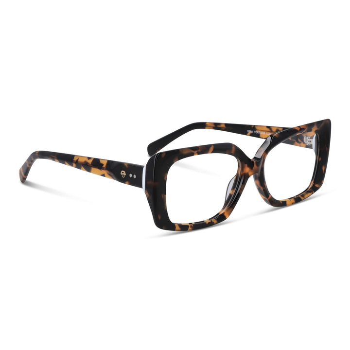 Vista 3/4 Domi gafas polarizadas carey destacando acabado premium #color_carey