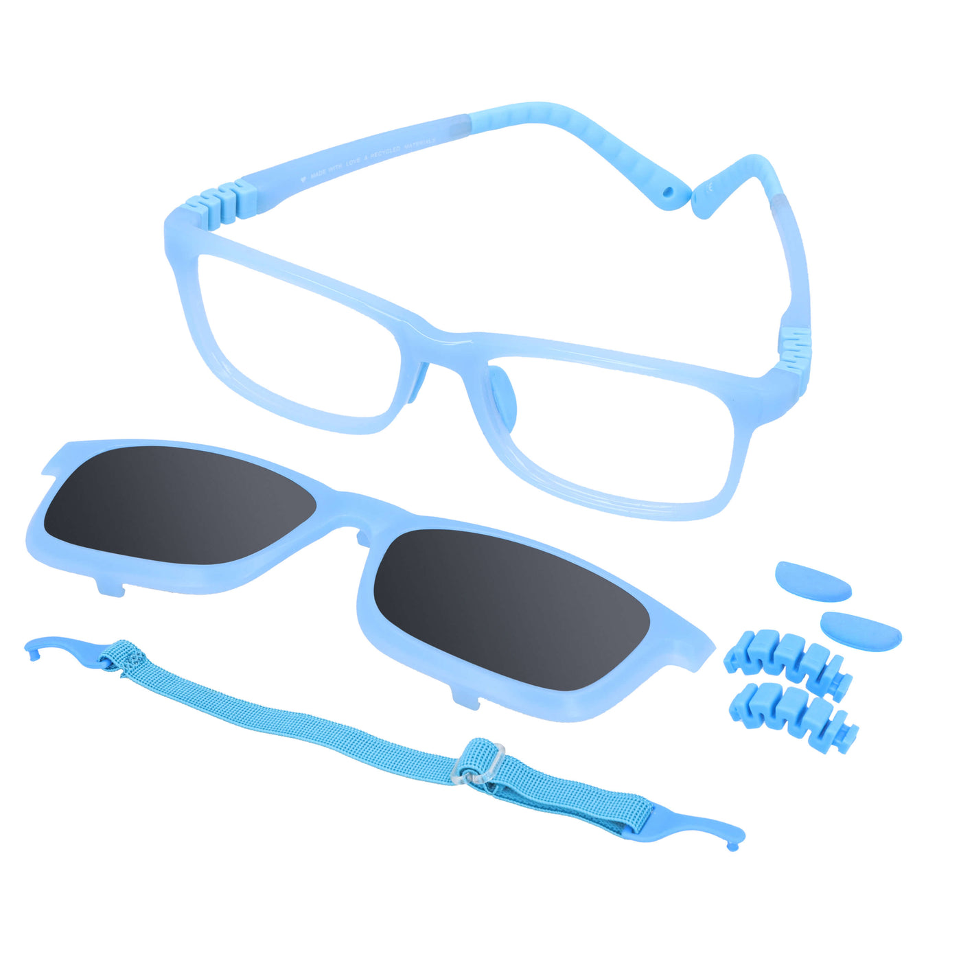 anteojos ópticos con receta para niños y niñas de forma rectangular y clip para el sol polarizado. En la parte inferior de la foto se ve un strap o colgante para los anteojos y en la parte derecha repuestos de las bisagras y de los nosepads. El anteojo es de color azul transparente y es una vista angulada desde arriba