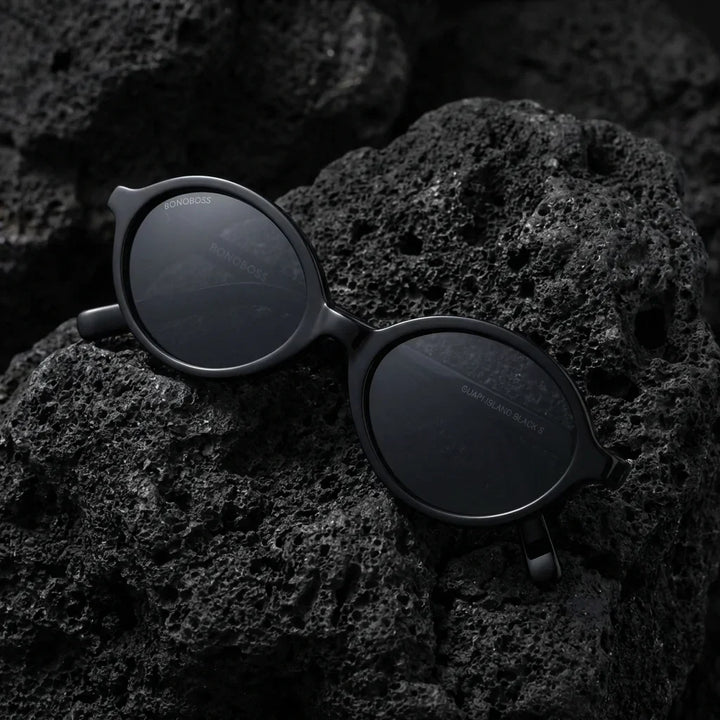 Lentes sol Guapi Island polarizados UV400 sobre roca volcanica textura natural Bonoboss #color_negro