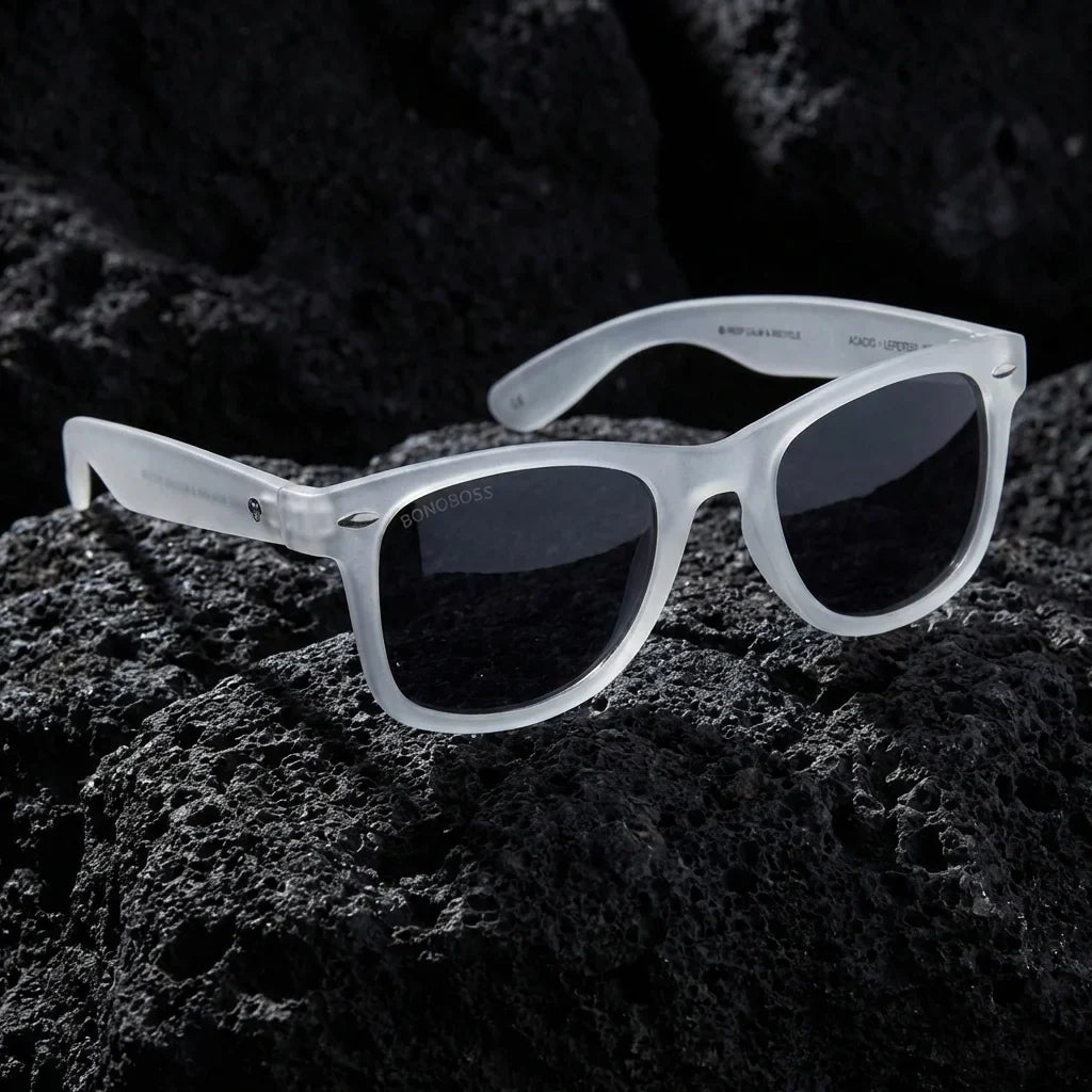 Lentes sol Acacio RPET polarizados UV400 sobre roca volcanica textura natural Bonoboss #color_transparente