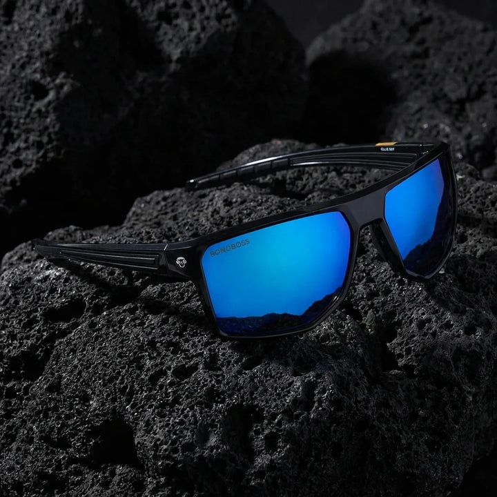 Lentes sol Ollie polarizados UV400 bio-acetato azul sobre roca volcanica textura natural contraste Bonoboss #editorial_grid1 #color_azul