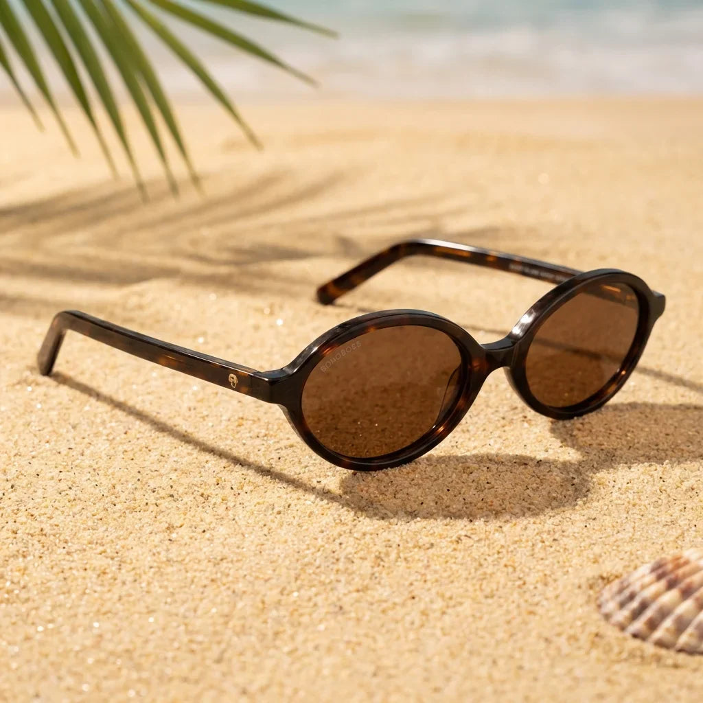 Lentes sol Guapi Island polarizados UV400 sobre arena dorada costa textura natural Bonoboss #color_carey