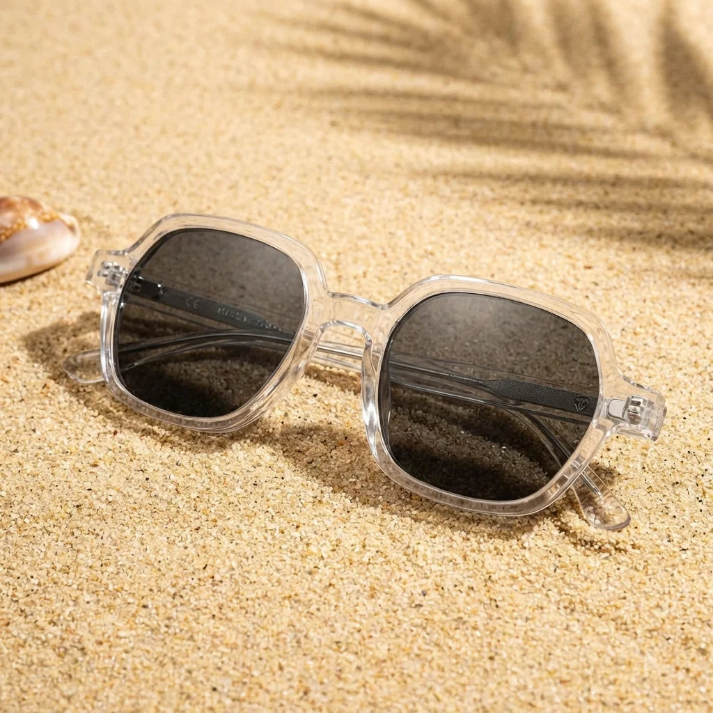 Lentes sol Canarias polarizados UV400 sobre arena dorada costa textura natural Bonoboss #color_transparente