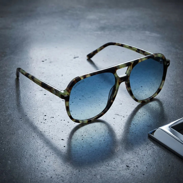 Lentes sol Orson E.D polarizados UV400 sobre concreto urbano textura industrial Bonoboss #color_verde