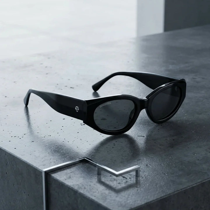 Lentes sol Milán polarizados UV400 sobre concreto urbano textura industrial Bonoboss #color_negro