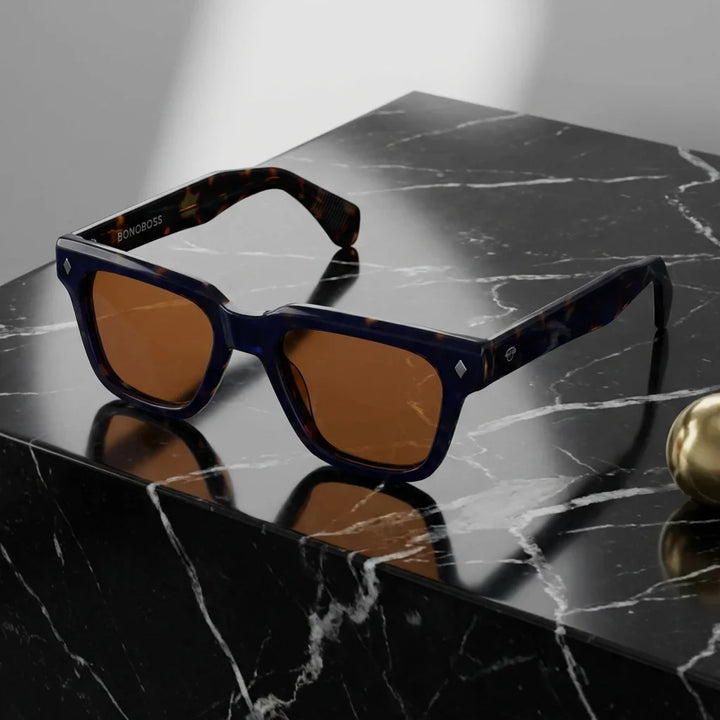 Lentes sol Bruno polarizados UV400 sobre marmol negro superficie elegante Bonoboss #color_carey