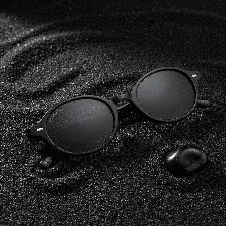 Lentes sol Capri polarizados UV400 sobre arena negra volcanica Bonoboss #color_negro