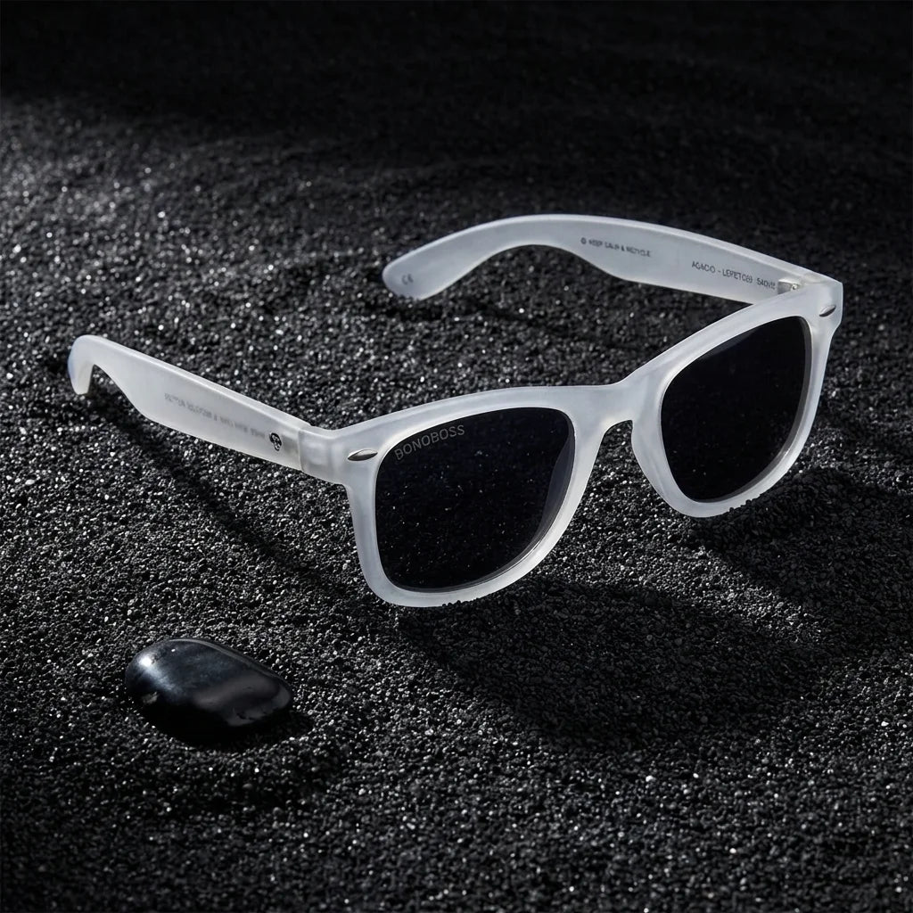 Lentes sol Acacio RPET polarizados UV400 sobre arena negra volcanica Bonoboss #color_transparente