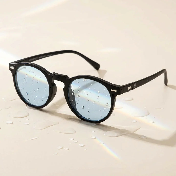 Lentes sol Temuco RPET polarizados UV400 sobre superficie con agua y luz natural Bonoboss #color_negro