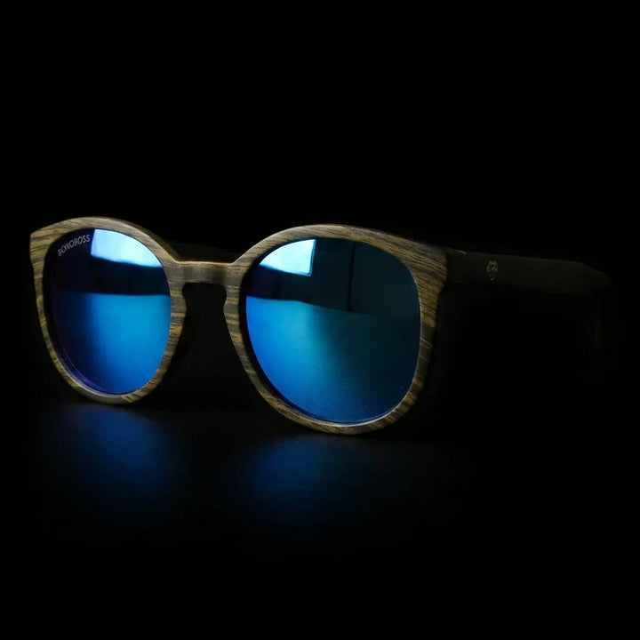 Lentes sol Meli Ebony polarizados UV400 frontal dramatico luz editorial Bonoboss #color_espejado-azul