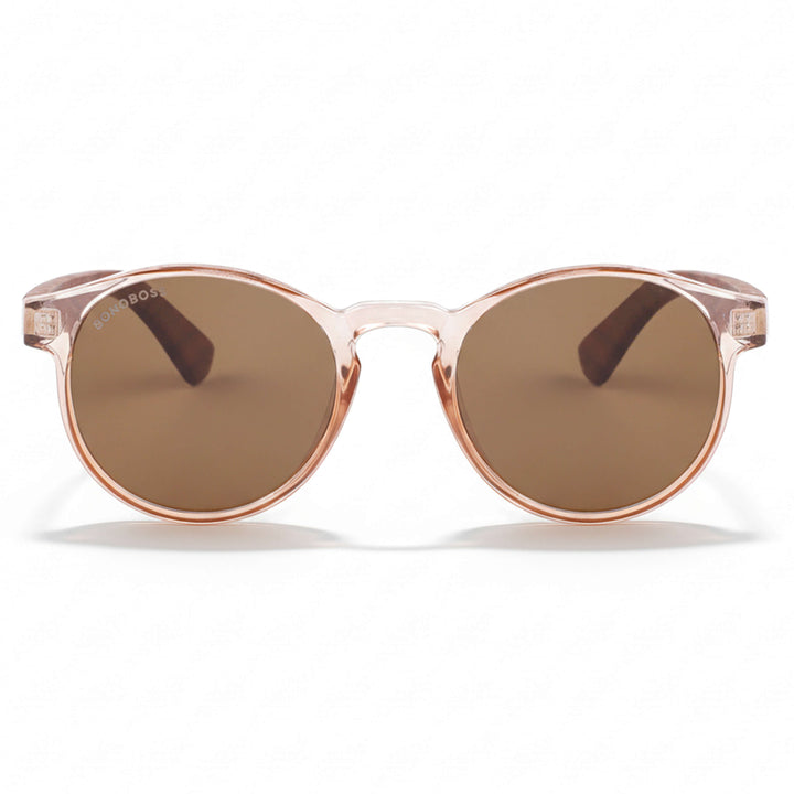 la vista frontal de unos anteojos anteojos gafas de sol polarizadas de forma redonda y con puente para narices anchas hechas de plastico reciclado sustentable ecologico personalizada y patas de madera de #color_rosa