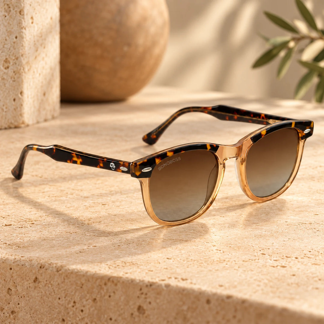 Lentes de sol polarizados Algarrobo Carey Nude lente Degradé Café bodegón sobre travertino con rama de olivo Bonoboss #editorial_banner #color_brown