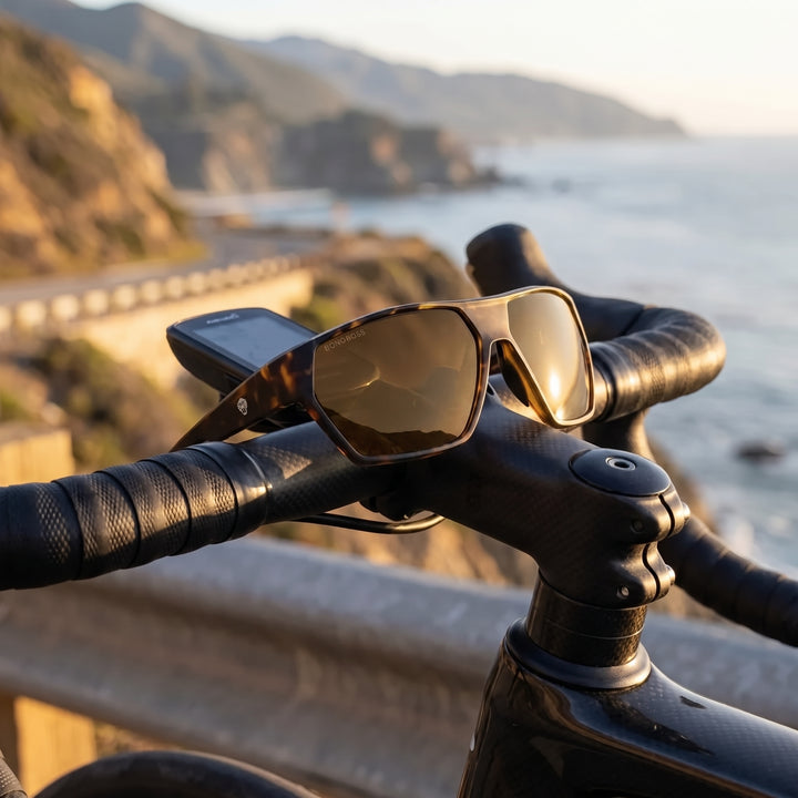 Bonoboss Andes Carey lentes de sol deportivos cristal café, detalle sobre manubrio de bicicleta #color_carey