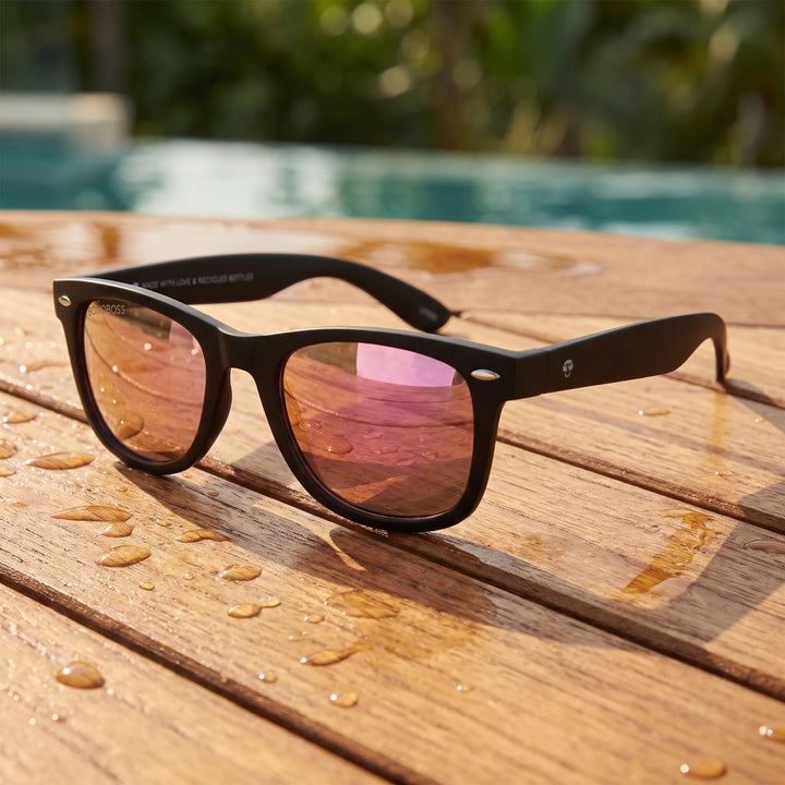 Lentes sol Acacio RPET polarizados UV400 sobre madera teca con agua fresca Bonoboss #color_espejado-pink