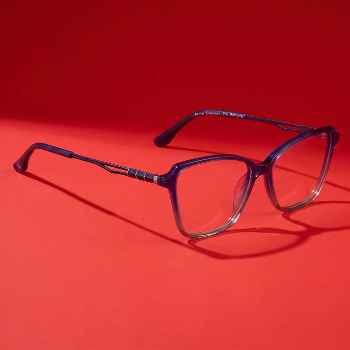 Anteojos Fiore 1006 en azul – hero still life against a deep vivid red backdrop