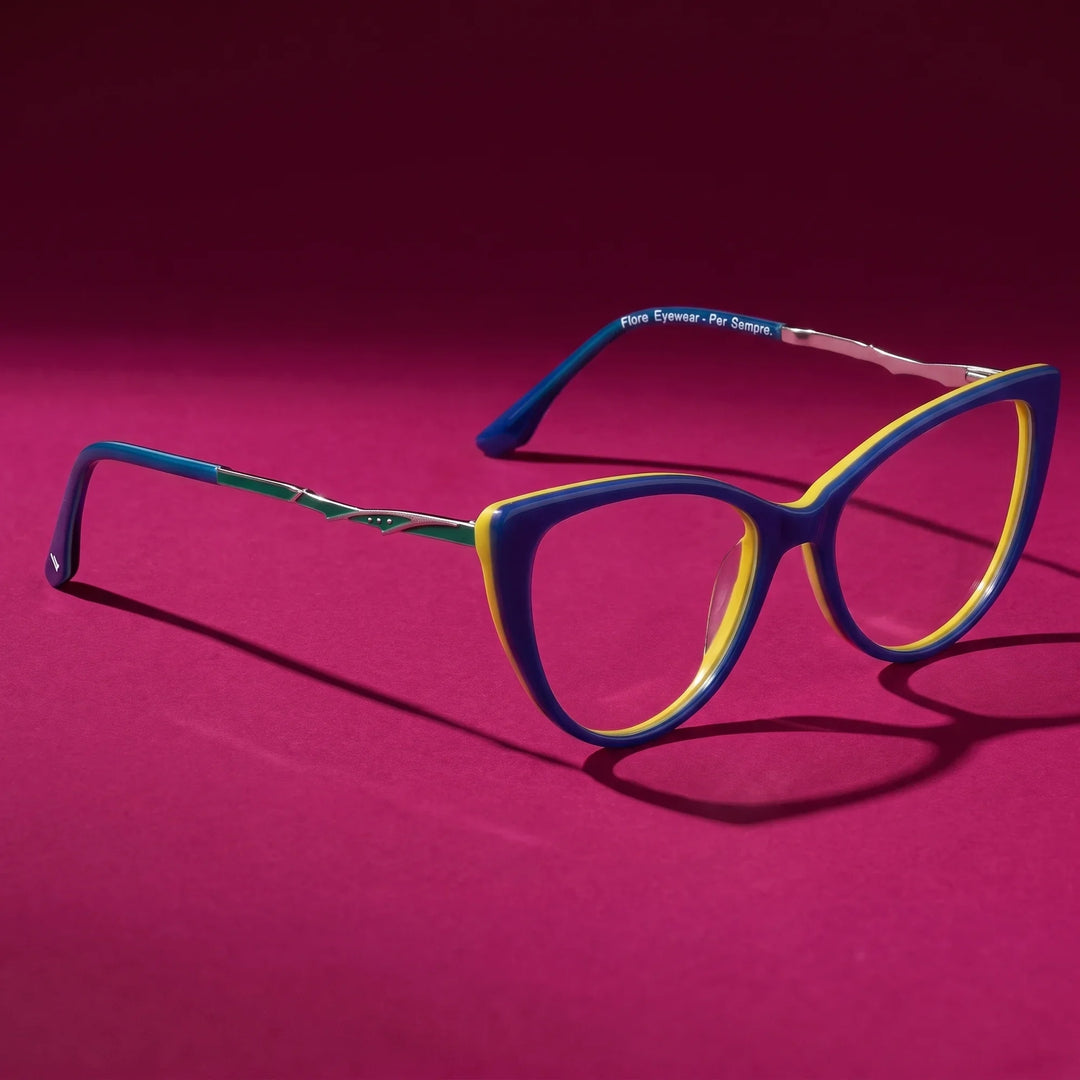 Anteojos Fiore 1010 en blue green – hero still life against a deep magenta backdrop
