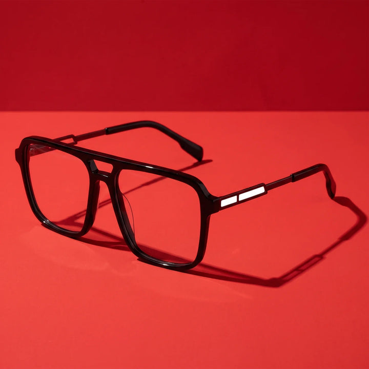 Anteojos Fiore 1014 en negro – editorial still life on a saturated vivid red set