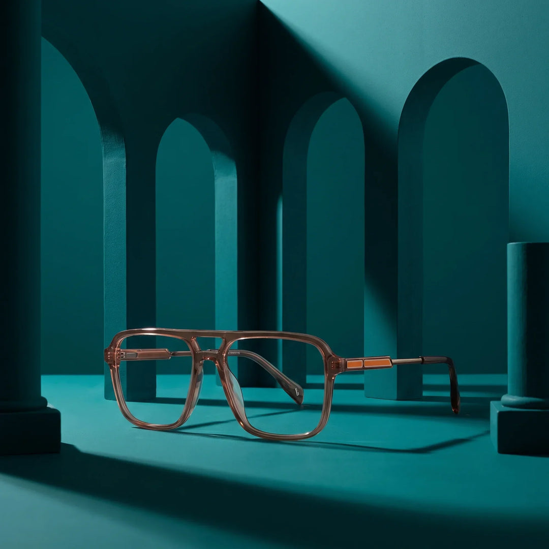 Anteojos Fiore 1014 en café – staged on a sculptural teal architecture set
