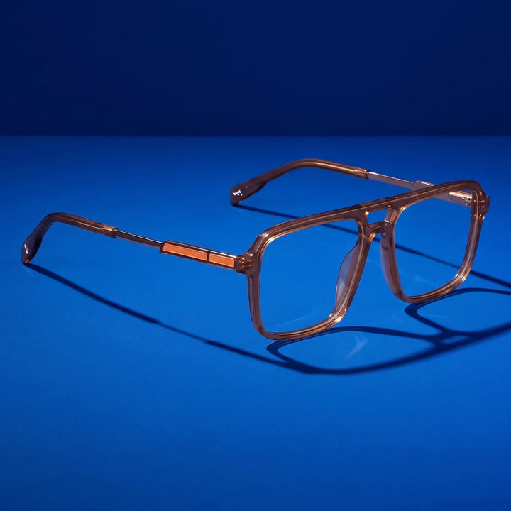 Anteojos Fiore 1014 en café – hero still life against a deep cobalt backdrop