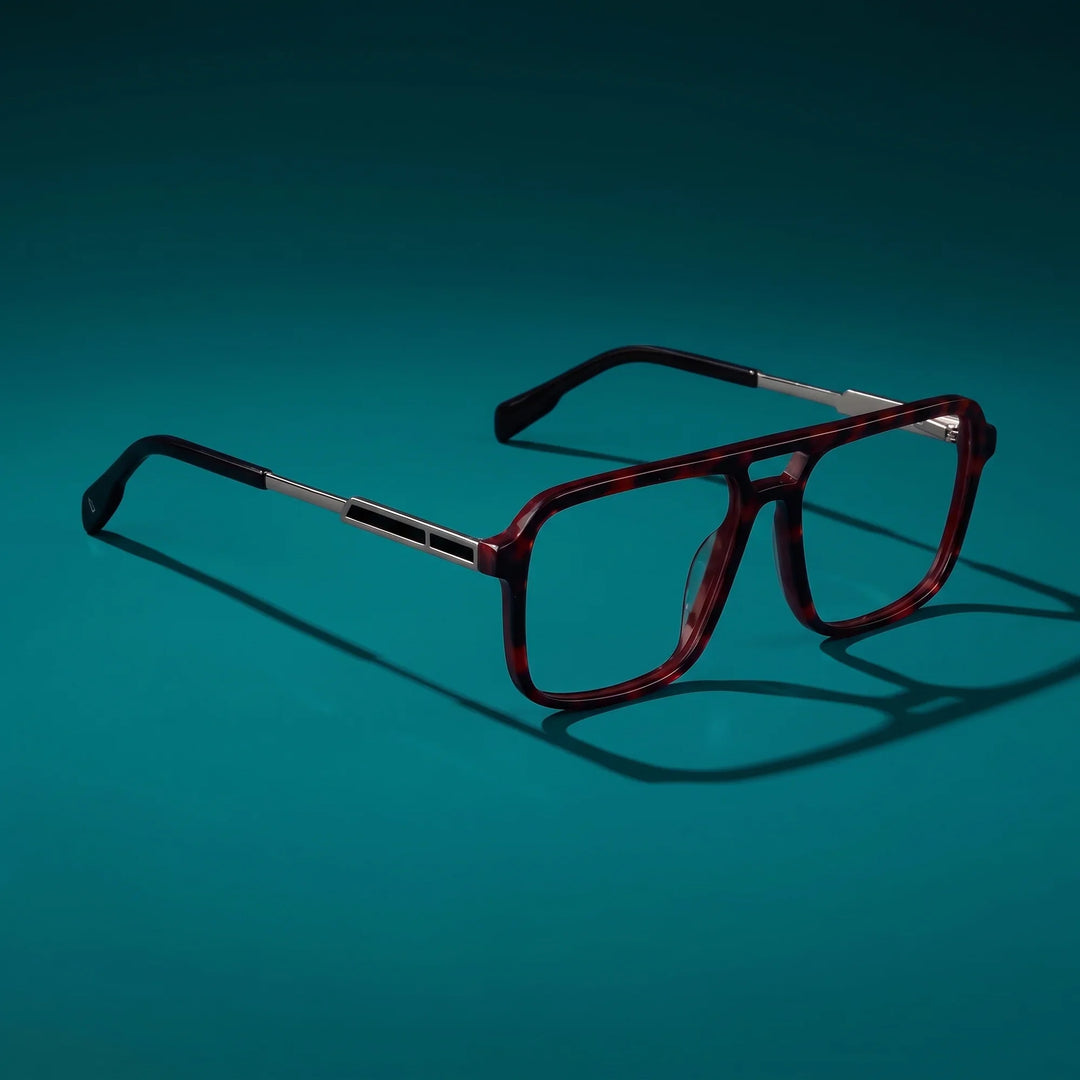 Anteojos Fiore 1014 en tortoiseshell – bodegón principal sobre fondo verde azulado profundo