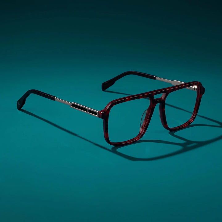 Anteojos Fiore 1014 en tortoiseshell – bodegón principal sobre fondo verde azulado profundo
