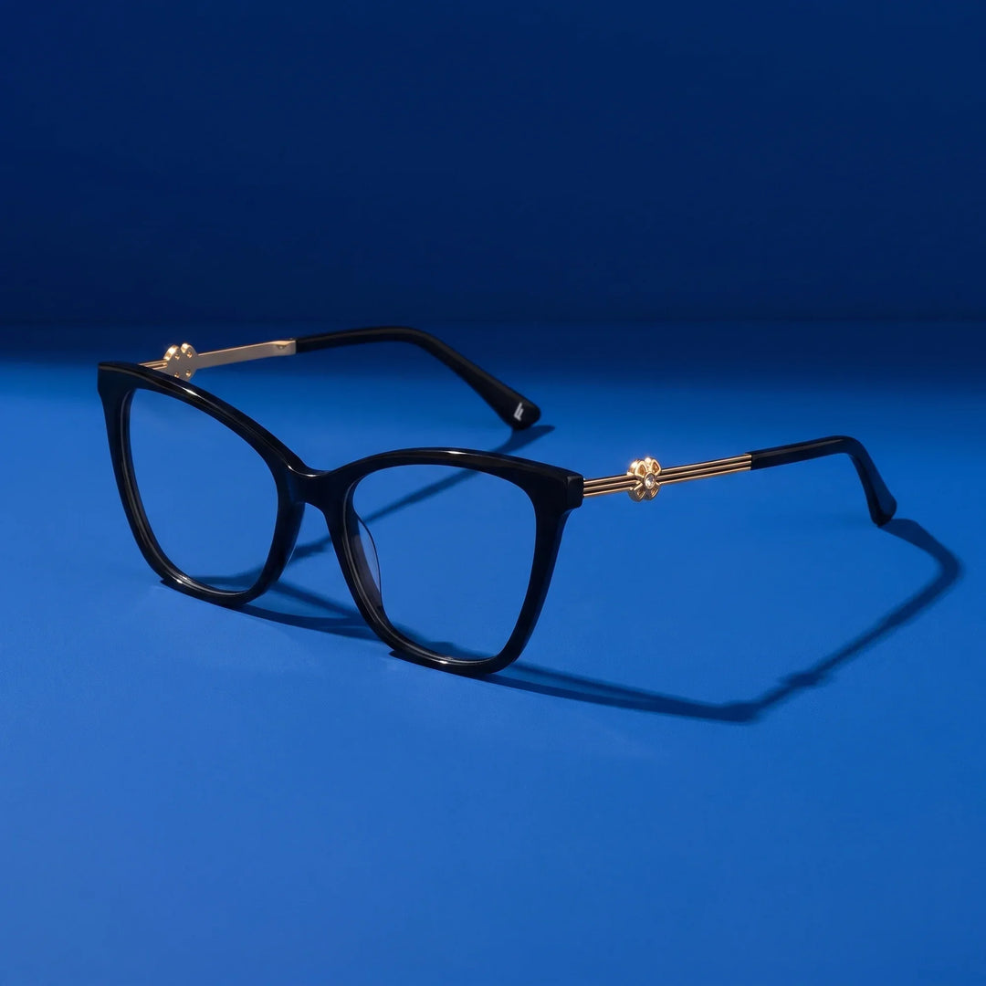 Anteojos Fiore 10172 en negro – hero still life against a deep cobalt backdrop