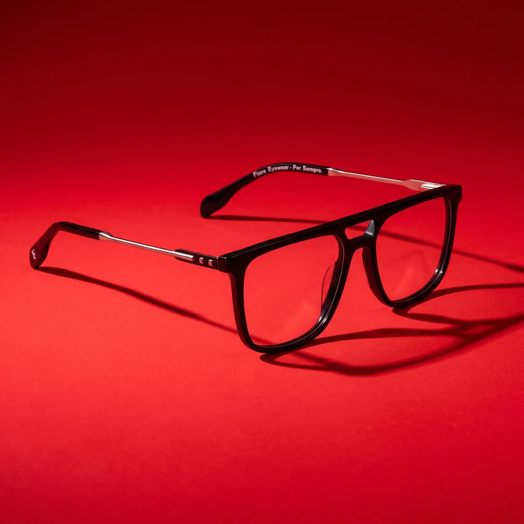 Anteojos Fiore 10177 en negro – editorial still life on a saturated vivid red set