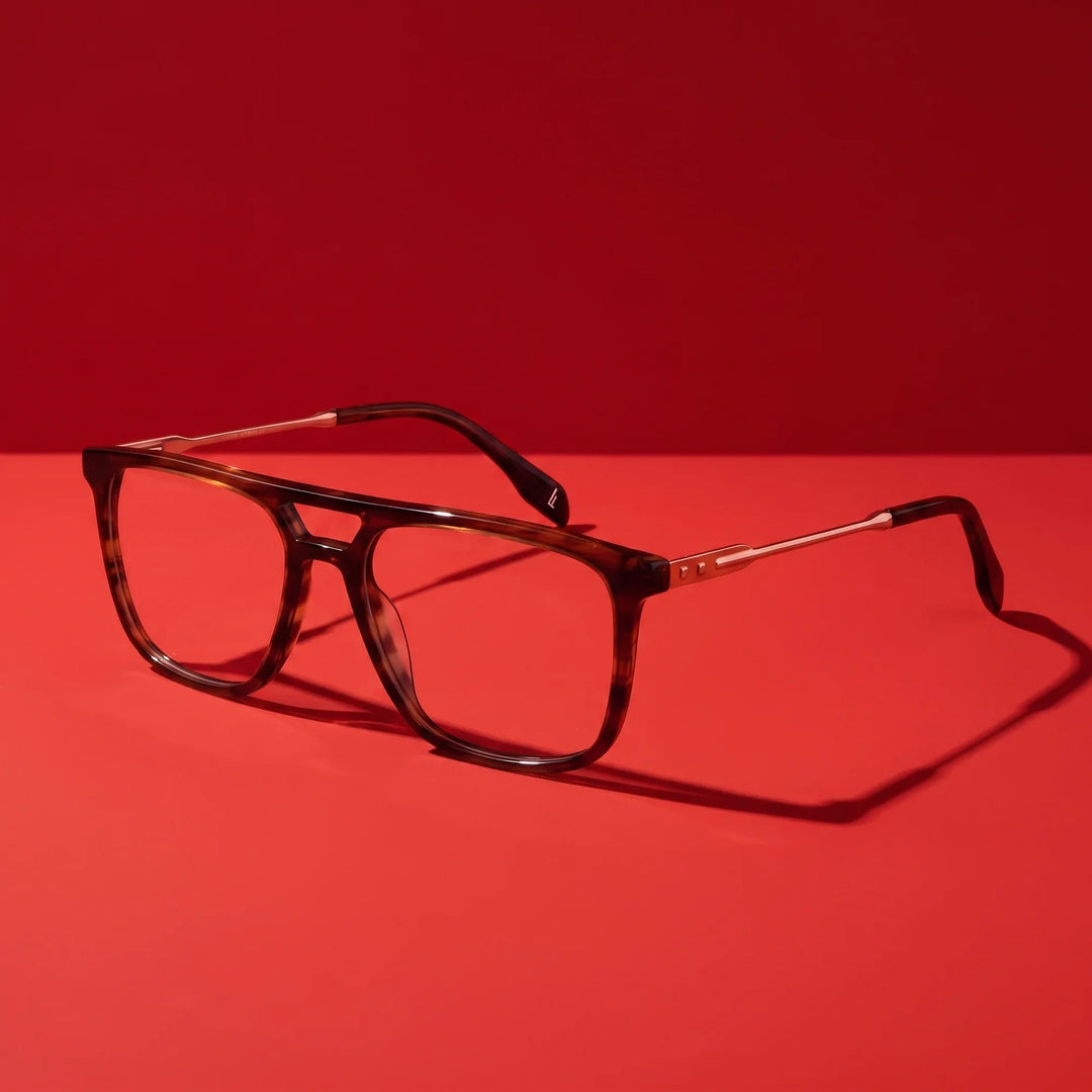 Anteojos Fiore 10177 en tortoiseshell – hero still life against a deep vivid red backdrop