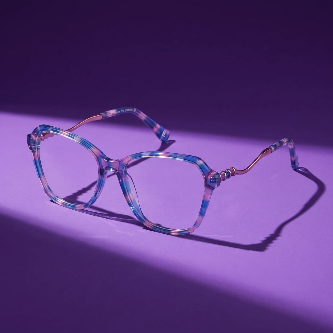 Anteojos Fiore 1030 en blue pink – still life on a seamless violet studio backdrop