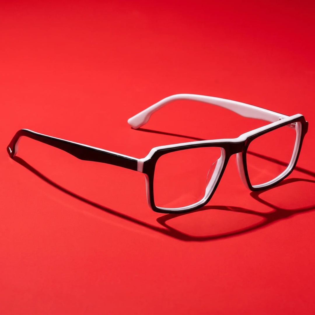 Anteojos Fiore 1038 en black white – editorial still life on a saturated vivid red set