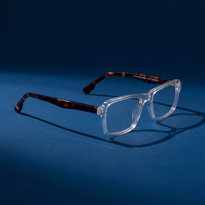 Anteojos Fiore 1038 en transparent – hero still life against a deep midnight blue backdrop