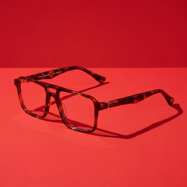 Anteojos Fiore 1039 en tortoiseshell – hero still life against a deep vivid red backdrop