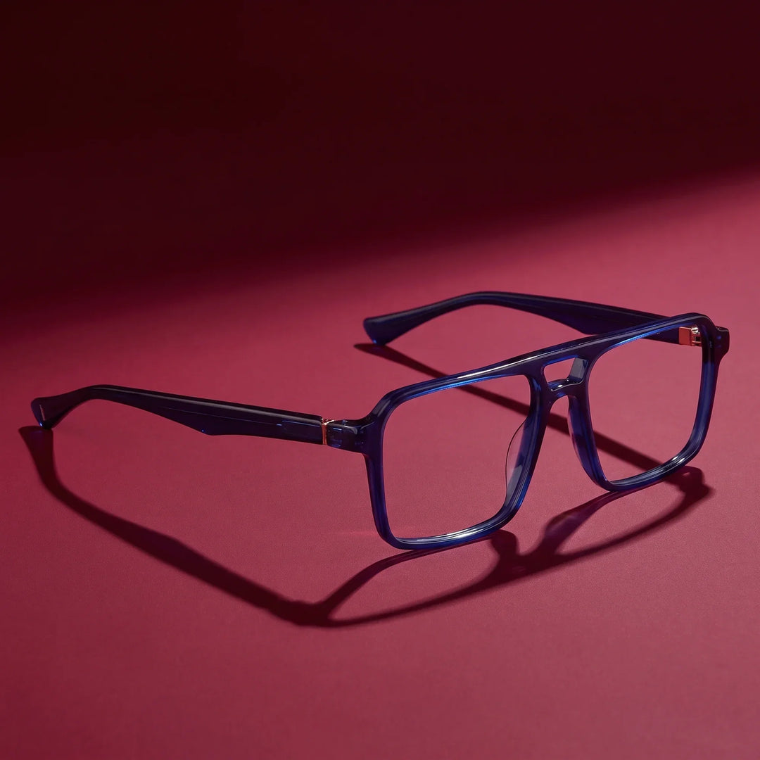 Anteojos Fiore 1039 en azul – editorial still life on a saturated burgundy set