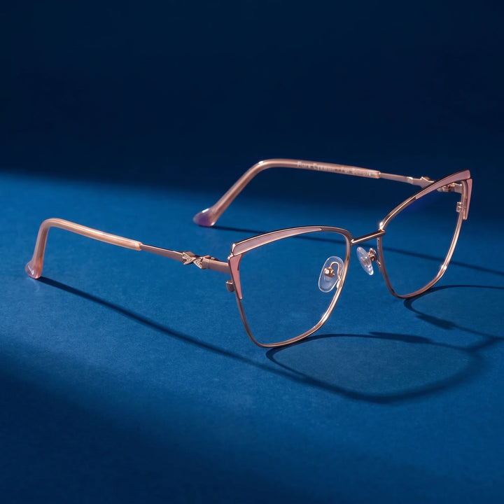 Anteojos Fiore 3837 en pink gold – hero still life against a deep midnight blue backdrop