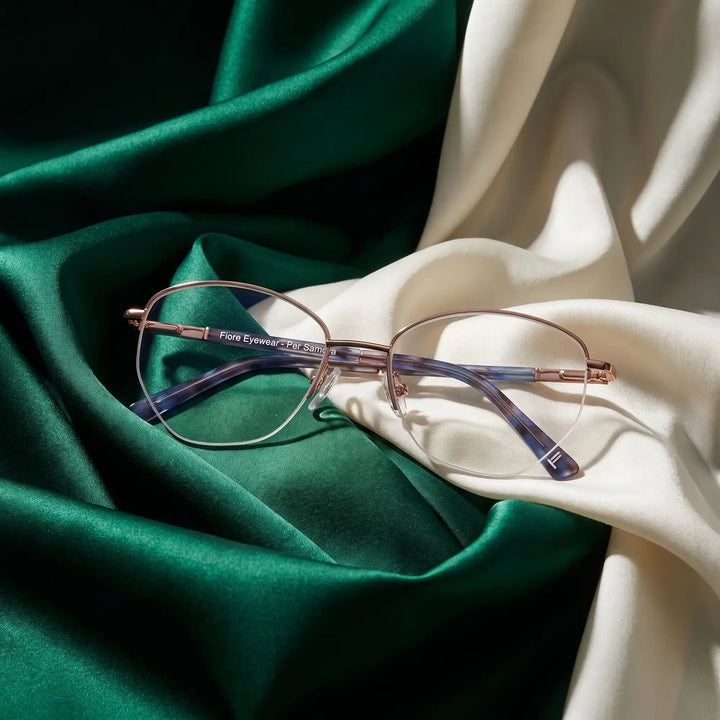 Anteojos Fiore 3921 en grey brown – resting on draped emerald and ivory silk