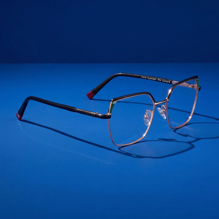 Anteojos Fiore 3971 en black gold – editorial still life on a saturated cobalt set