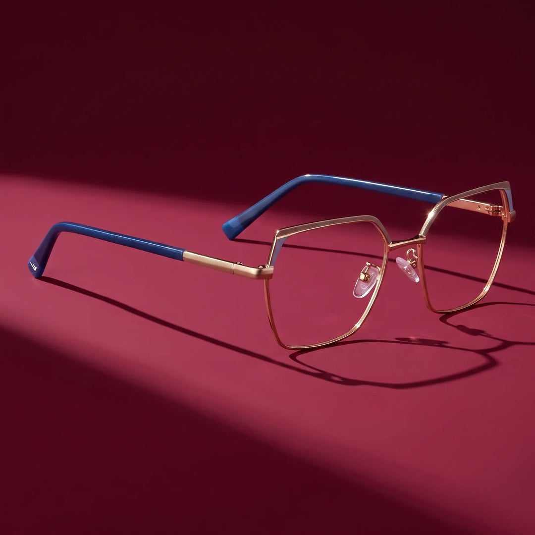 Anteojos Fiore 3971 en gris dorado – editorial still life on a saturated burgundy set