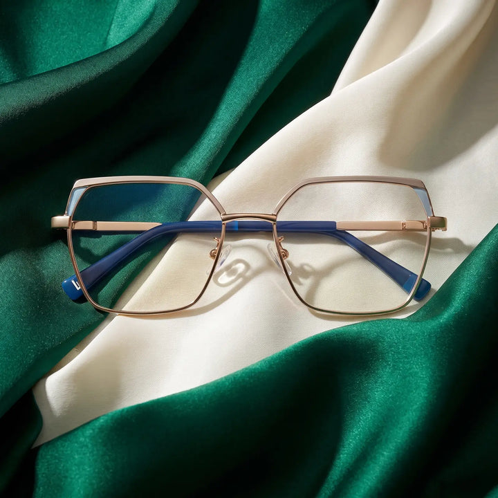 Anteojos Fiore 3971 en grey gold – resting on draped emerald and ivory silk