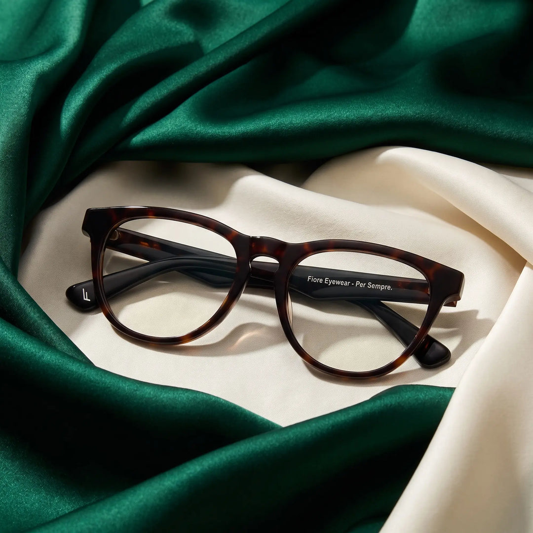 Anteojos Fiore 4488 en tortoiseshell – resting on draped emerald and ivory silk