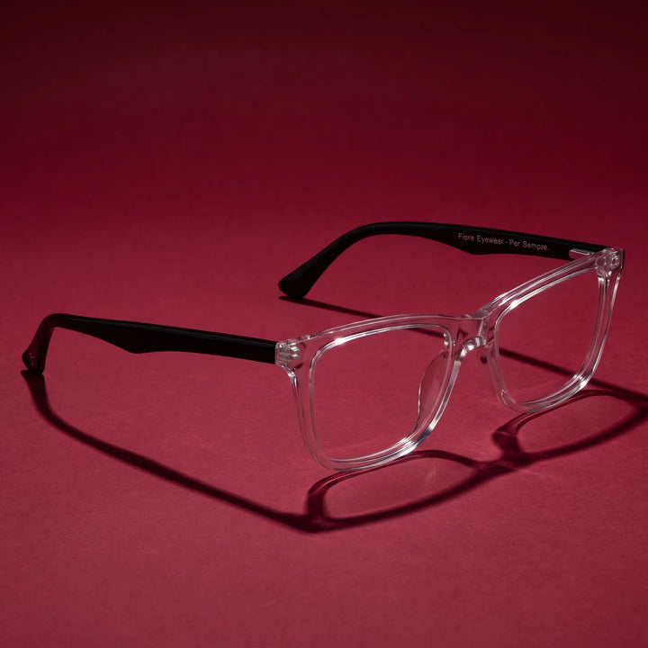 Anteojos Fiore 5228 en transparent – editorial still life on a saturated burgundy set