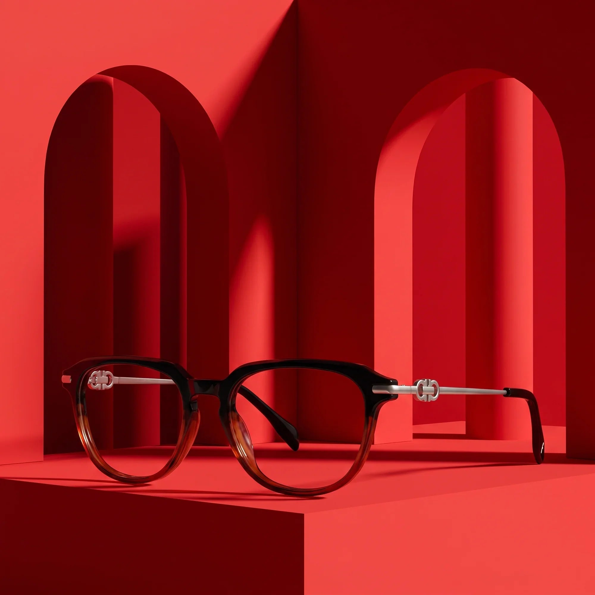 Anteojos Fiore 5409 en black brown – staged on a sculptural vivid red architecture set