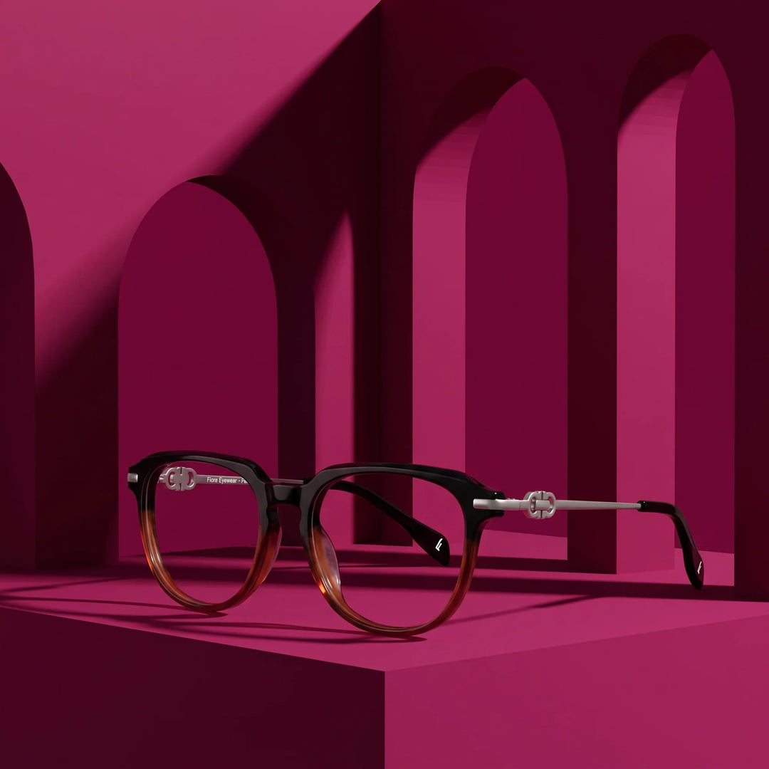Anteojos Fiore 5409 en black brown – displayed on a magenta podium among arches