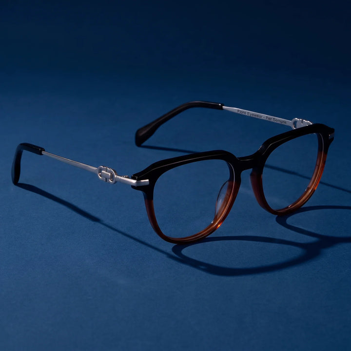 Anteojos Fiore 5409 en black brown – hero still life against a deep midnight blue backdrop