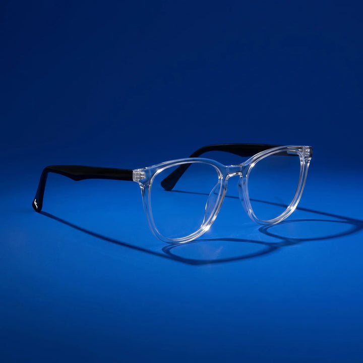 Anteojos Fiore 7046 en transparent – hero still life against a deep cobalt backdrop