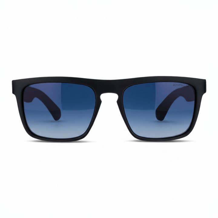 anteojos de sol rectangulares polarizados negros pata de madera natural d nogal en una vista frontal con lentes de color degrade azul para migraña #color_degrade-azul